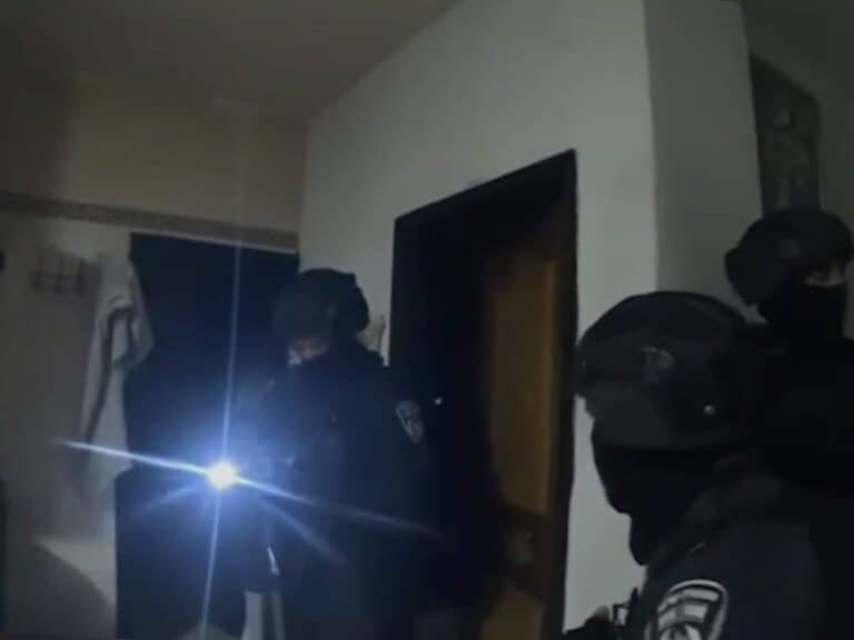Israeli police forces conduct a nighttime raid near Jerusalem as part of a regional crackdown