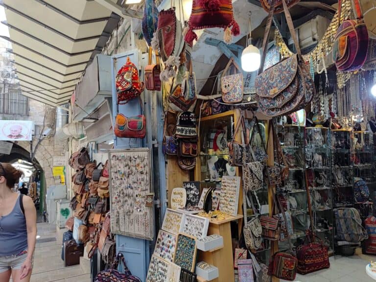 A colorful market stall in Jerusalem’s Old City, with handmade bags, jewelry, and souvenirs – life goes on despite the looming threat of Iranian missile attacks