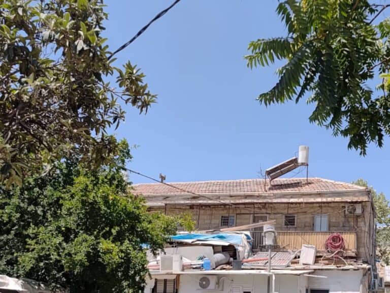 Blue sky and old rooftop in Jerusalem on a hot summer day, June 19, 2025