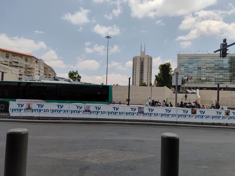 Portrait posters of fallen Israeli soldiers along sidewalk near Binyanei HaUma, Jerusalem
