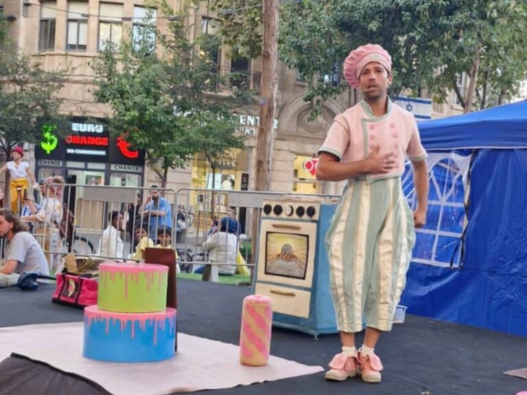 Street performer in Jerusalem entertaining families along the light rail tracks during summer events downtown
