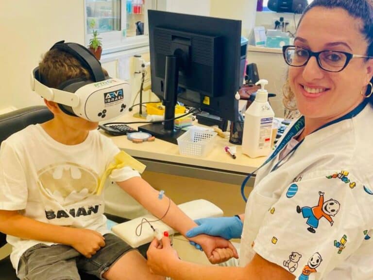 child using VR headset during medical treatment in Jerusalem clinic