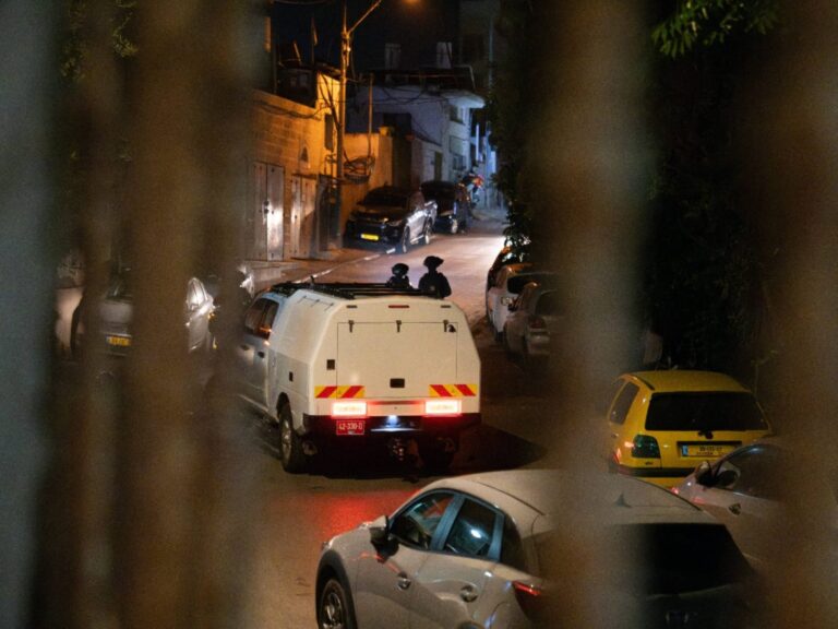 Armed police in East Jerusalem conducting a night raid during an undercover arms sting operation.