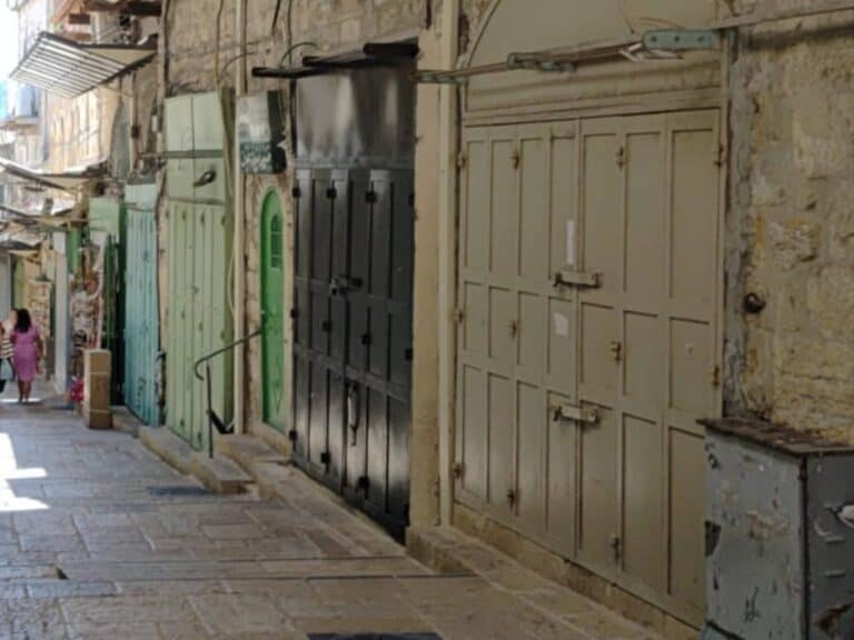 Al-Wad Street in Jerusalem’s Old City, closed and empty, reflecting rising tension linked to the Gaza conflict