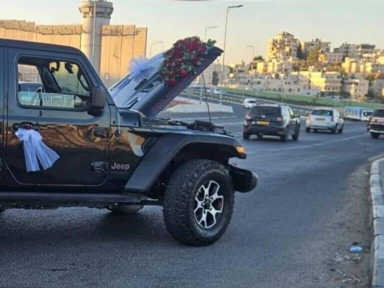 Decorated wedding vehicle blocked by police in Jerusalem wedding convoy crackdown