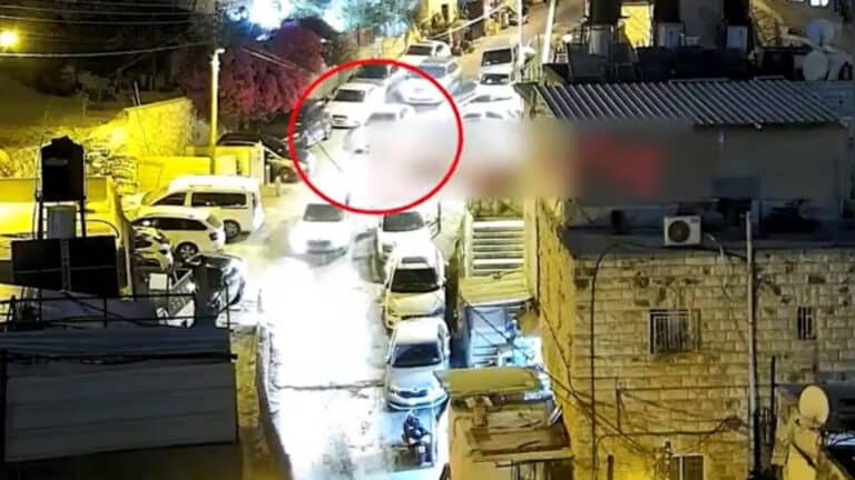 Police officers in East Jerusalem chase an armed suspect who aimed a loaded gun at them before being shot during the attempted arrest