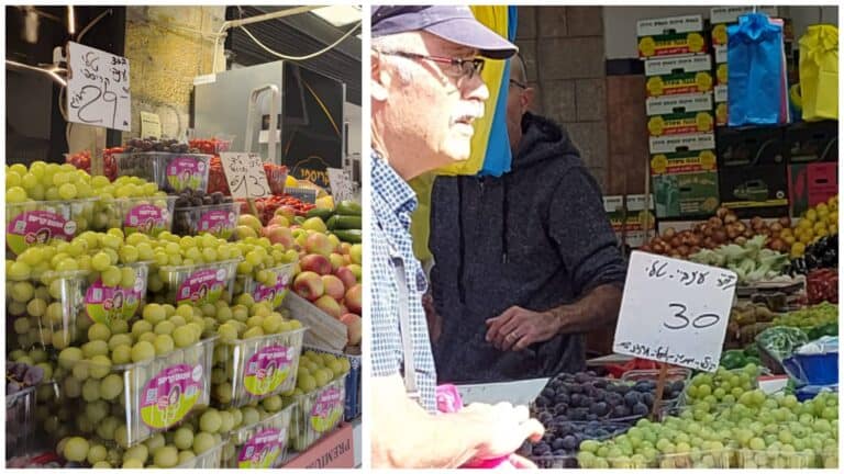 אשכולות ענבים בדוכני שוק מחנה יהודה בירושלים, עם שלטים המציינים מחיר של כ־30 שקל לקילו