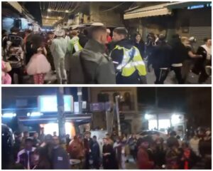 שוטרים מתמודדים עם אלפי חוגגים שהתקהלו במרכז ירושלים במהלך אזעקות