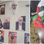 קיר עם תמונות דמויות המזוהות עם ארגונים חמושים ודגלים שנמצאו בדירה במזרח ירושלים