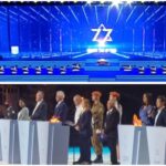 טקס הדלקת המשואות בהר הרצל בירושלים עם במה מוארת וסמל מגן דוד לצד מדליקי משואות ואנשי ציבור