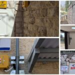מערכת פתיחה מרחוק למקלט ציבורי בירושלים עם שילוט חירום וקופסת שליטה על קיר אבן