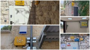 מערכת פתיחה מרחוק למקלט ציבורי בירושלים עם שילוט חירום וקופסת שליטה על קיר אבן