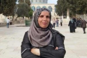 Raida Saeed al-Joulani, a Murabitat activist from East Jerusalem, at the Temple Mount compound with the Dome of the Rock in the background